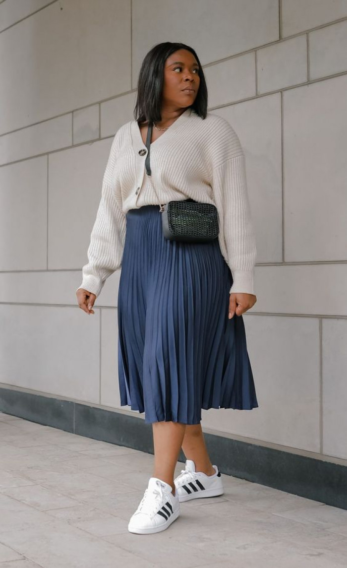 Cream Cardigan with Navy Blue Pleated Skirt